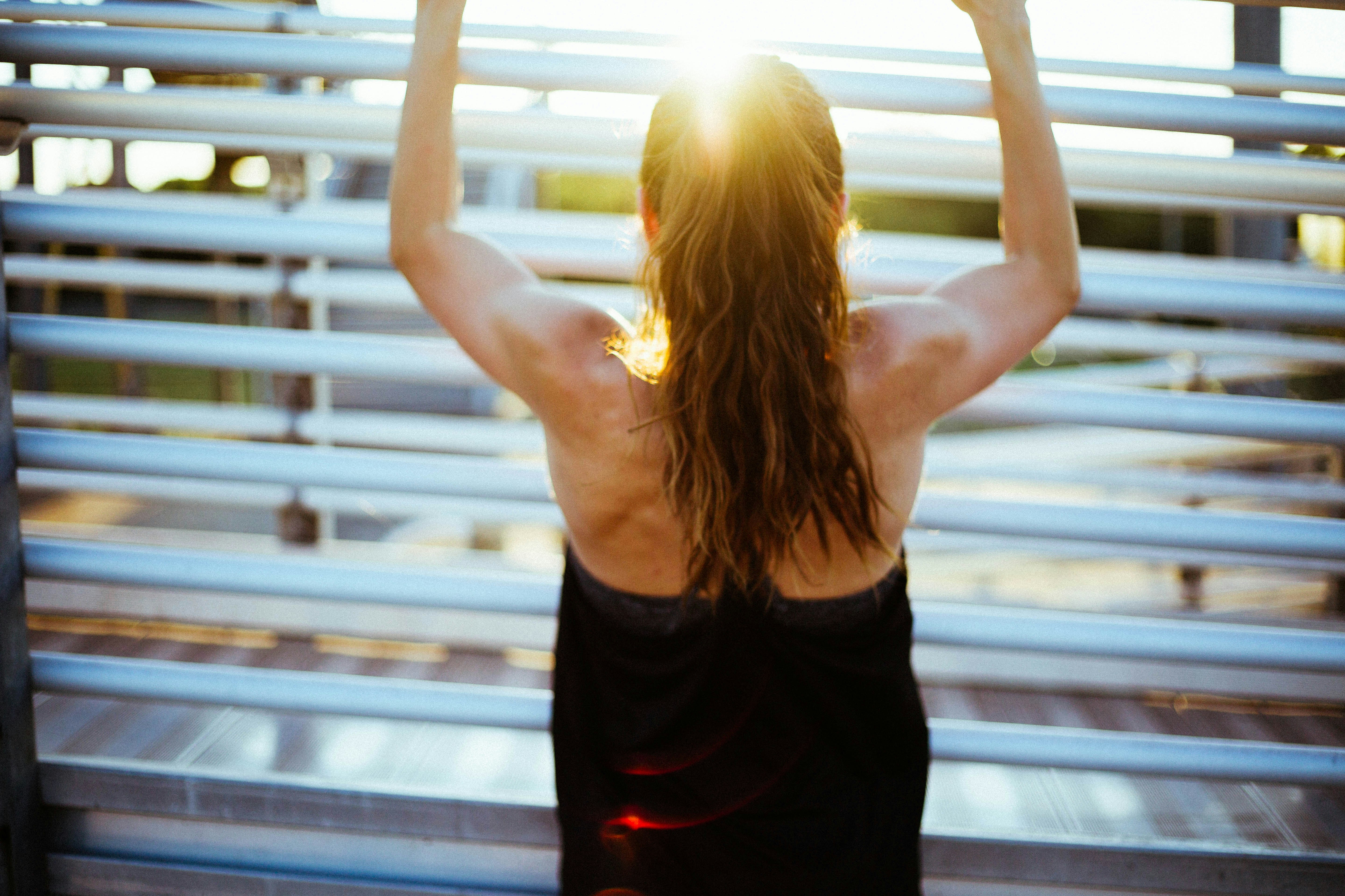 woman doing pull up exercise